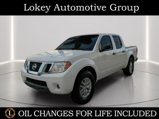 2021 Nissan Frontier SV in Glacier White — front three-quarter view