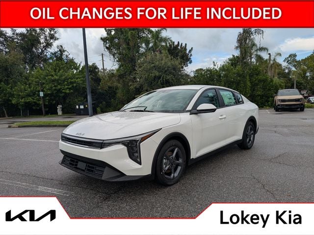 2026 Kia K4 LXS in Snow White Pearl — front three-quarter view